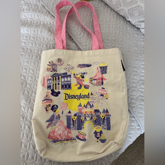 Disney Handbags - Gently used Disney Cream Tote Bag with Pink Handles